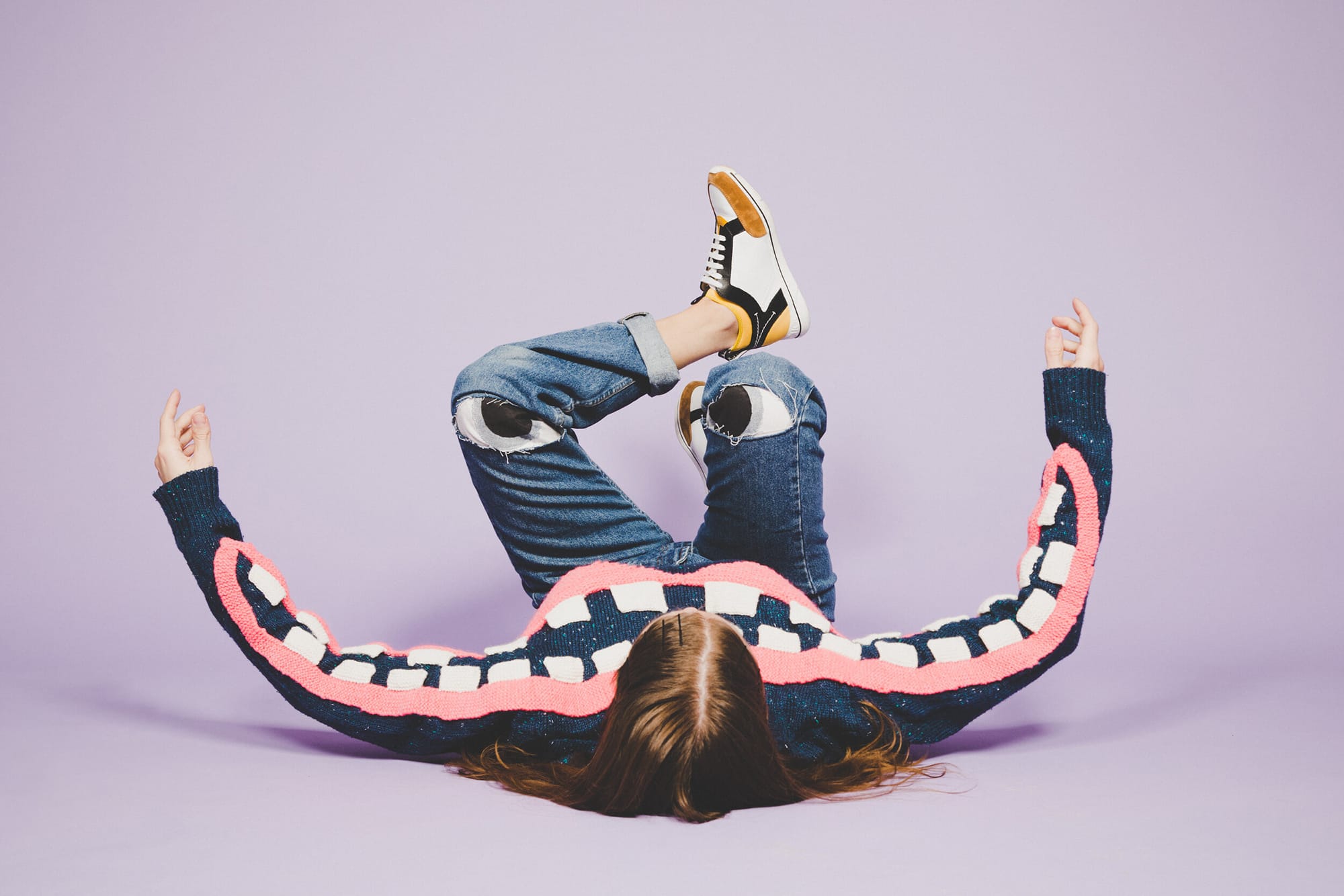 Jóhannsdóttir, Artist laying on floor wearing tooth sweater
